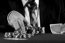 Man betting on the casino in black and white