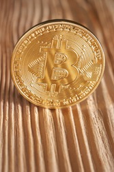 Golden bitcoin on wooden background. Bitcoin crypto currency, Blockchain technology, digital money, Mining concept