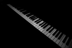 Background music, black and white piano keys in the dark. Piano keys diagonally