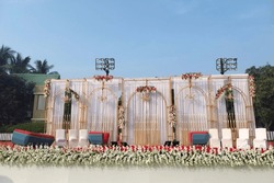 India Wedding event stage decorated with flower, chair, light