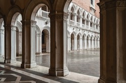 View into the courtyard of the Doge's Palace through the arches of the gallery.