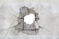Impact hole in reinforced concrete wall. Blank mock-up 