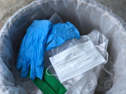 Used infectious masks and medical glove in the trash bin,infectious waste, prevented virus covid-19 by separating infected waste.