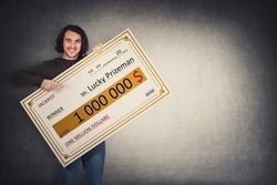 Excited man holding a lottery winner bank check. Happy guy jackpot winning one million dollars prize. Big banner announcing the main award. Wealth, luck and success concept. Becoming a millionaire