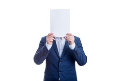 Anonymous businessman covering face with a blank paper sheet, like a mask to hide emotions. Incognito person hidden, isolated on white background. Introvert people concept