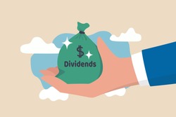 Dividend stocks, public company payback profit in stock market, return or profit from investment concept, businessman investor hand holding big money bag with label Dividends and dollar money sign.