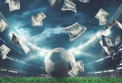 Banknotes raining on the soccer field. Business in the sports world