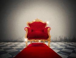 Sparkling golden armchair in a red carpet