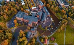 Autumn view from the air of the old spinning mill of Forssa by the river, Finland