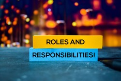 Roles and Responsibilities! on the sticky notes with bokeh background