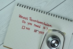 Concept of Yes, Venous Thromboembolism write on sticky notes isolated on Wooden Table.