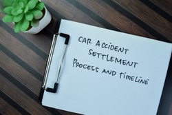 Concept of Car Accident Settlement Process and Timeline write on paperwork isolated on Wooden Table.