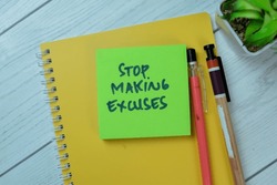 Concept of Stop Making Excuses write on sticky notes isolated on Wooden Table.