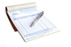 invoice book with open blank page and pen