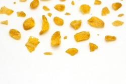 Golden cornflakes splash on white background with copy space text