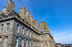 Saint-Malo - port city in Brittany. Architecture of the old city. Urban scene, city life.