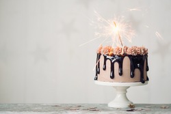 Chocolate drip cake with sparkler for a birthday or celebration