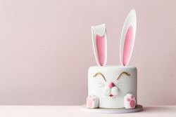 Easter bunny celebration cake on a pink background