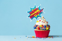 Celebration birthday cupcake with superhero happy birthday cake pick