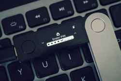 Hardware Wallet for cryptocurrency on keyboard for pin code