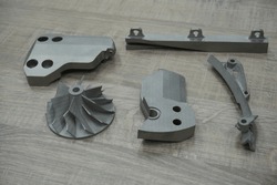 Metallic 3D printing, example of mechanical components of mechanical parts made with metallic 3D printing. Modern additive technology with laser and metallic powders, sintering.