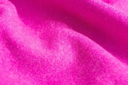 Background texture of magenta Cashmere sweater. Close up. Cozy and warm New Year's concept.