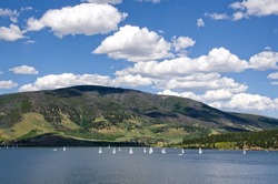A sailboat regatta on Lake Dillon in Frisco, Colorado is always an interesting sight.  The mountains behind, however, are still showing the results of a pine beetle infestation.