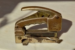 Old stapler. old elements. country house Antique objects