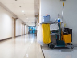 Cleaning tools cart wait for maid or cleaner in the hospital. Bucket and set of cleaning equipment in the hospital. Concept of service, worker and equipment for cleaner and health