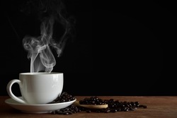 coffee cup smoke and bean black background