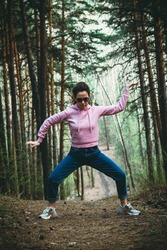 Woman practice Tai Chi Chuan in a park. Chinese management skill Qi's energy. solo outdoor activities. Social Distancing