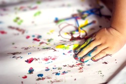 education, school, art and painting concept - little student girl showing painted hands