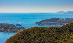 Panoramic view of St. Jean Cap Ferrat cape and Beaulieu sur Mer village seen from historic town of Eze over Azure Cost of Mediterranean Sea in France