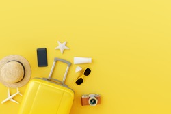 Flat lay yellow suitcase with traveler accessories on yellow background. travel concept