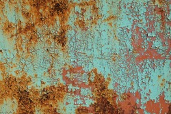 Metal rusty surface with shabby background paint. Texture blue cracked paint on an iron sheet. Fragment of an old metal gate, Metal Corrosion  