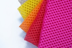 Bright Color palette of special textile mesh. Polyester mesh with foam rubber for the manufacture of backpacks. Lining mesh with foam for the inside of a bag or clothes.