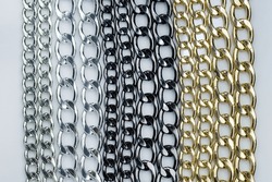 Decorative chains for bag handles and designer decoration of products. Metal chains in black, gold and silver colors to decorate garments.