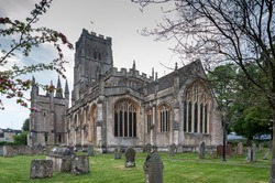 St Peter and St Pauls Church and its graveyard with tombs in Northleach town, Gloucestershire, Cotswolds, England - United Kingdom