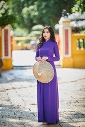 Ho Chi Minh city, Viet Nam: Vietnamese girl going to pagoda in ao dai