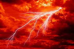 dramatic Red clouds and lightning for pattern background. A burning sky in a horror movie.  crimson storm in apocalyptic, judgment day.