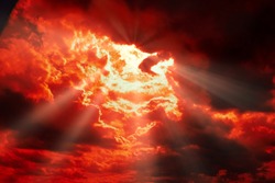 dramatic Red clouds and sunray for pattern background. A burning sky in a horror movie.  crimson storm in apocalyptic, judgment day.