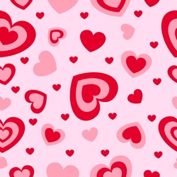 St Valentine’s Day. Seamless pattern with red and pink hearts. Pink background. Decorative ornament. Love and romance. Template for post cards, wallpaper, textile, scrapbooking and wrapping paper