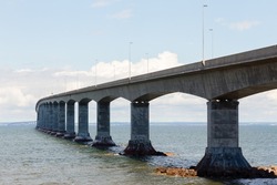 Low angle view of the box girder 12.9 km Confederation Bridge seen during a sunny day from Cape Jourimain on the New-Brunswick shore, Canada