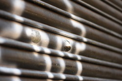 Closeup on roller shutter garage door abstract textured background in Barcelona, Spain.
