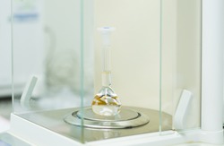 The volumetric flask contain with water placed on analytical balance for volumetric glassware calibration.