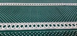 The appearance green prayer mat on the mosque. Sajadah. The prayer mat is used as a base when praying the Muslims.