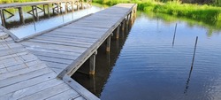 Rustic wooden bridge over a pond