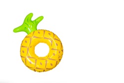 A pine apple pool floats isolate in white background with copy space. (summer time concept)
