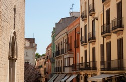 Exterior view of historical buildings in one of the old town streets of Figueres, the province of Gerona, Catalonia, Spain, Europe.