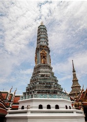 Towers of Wat Phra Kaew, Grand Palace, Bangkok (Krung Thep), Thailand, Asia. Temple of the Emerald Buddha is the most important Buddhist temple in Thailand. Colorful traditional Asian architecture.